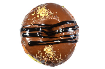 Chocolate topping and dark chocolate sauce and hazelnut pieces on a ring donut, a glazed, yeast...