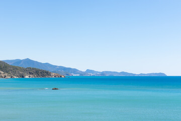 Obraz premium Beautiful view of the mediterranean sea and a rock in the seashore