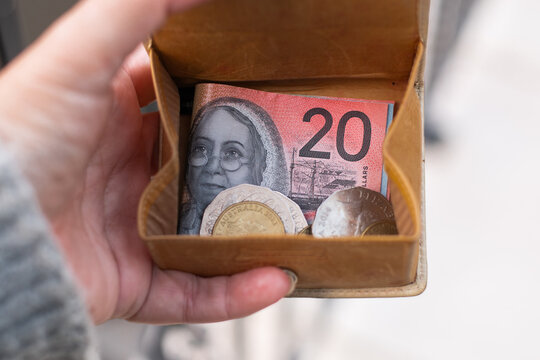coin purse in womans hand, with australian money