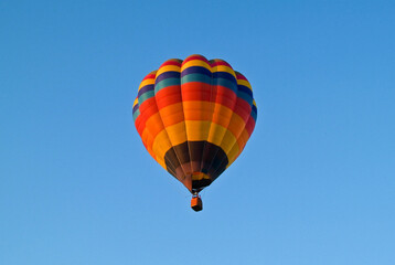 Colorful hot air balloons on a cloudy blue sky
