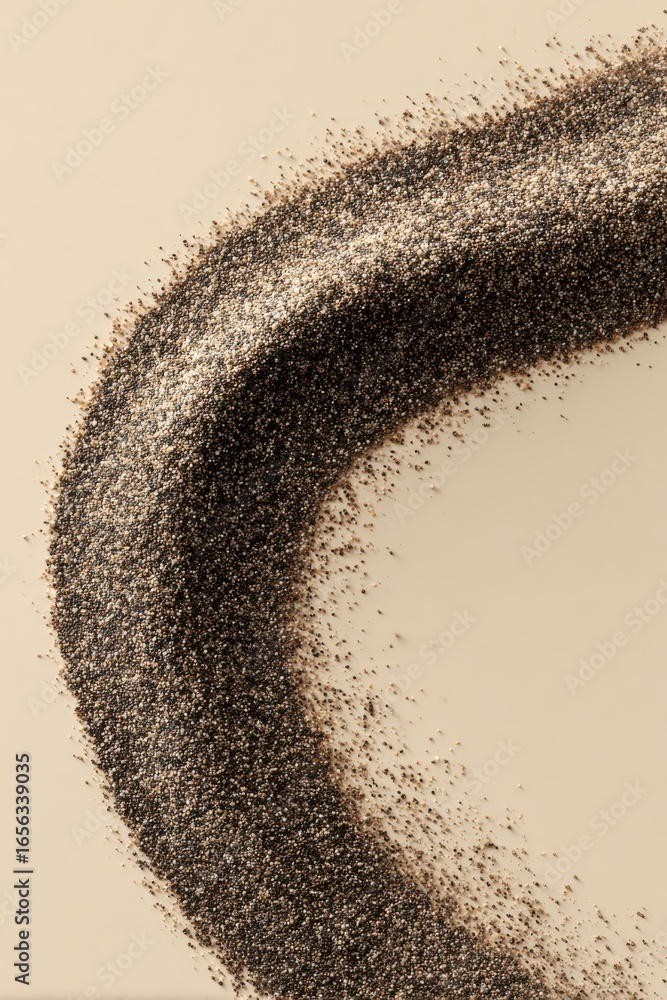 Aufkleber fine granular particles forming curved patterns on a smooth surface with soft natural lighting