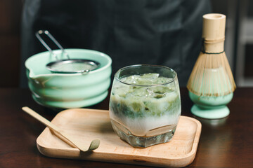 Matcha green tea with soy milk in a glass of cold. refreshing ice
