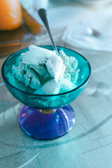 Italian dessert with green gelato served in a glass cup