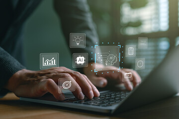Businessman using laptop with virtual icons of AI artificial intelligence, data analytics, machine learning and digital technology for business automation and innovation strategy, technology AI.