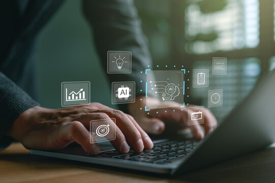 Businessman using laptop with virtual icons of AI artificial intelligence, data analytics, machine learning and digital technology for business automation and innovation strategy, technology AI.