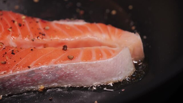 Fresh salmon steaks on the pan. Healthy food concept.