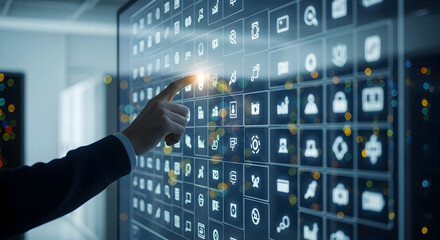 Person's finger touching interactive screen with modern technology icons, data visualization