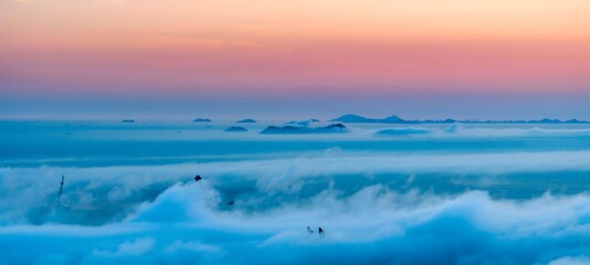 Pilot Flying Through Clouds at Sunset Over Shengsi Island China - Adventurous Summer Aerial View