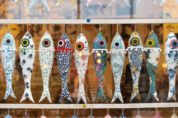 Decorative small fabric fishes in the souvenir shop window in Porto, Portugal