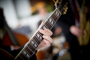 Fototapeta premium Close up of a guitar player (hand)