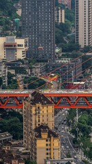 Fototapeta premium Aerial View of Chongqing China Urban Architecture with Red Bridge and Mountain Cityscape