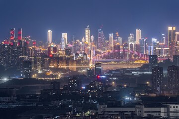 Aerial Night View of Chongqing China Cityscape with Illuminated Skyscrapers and Bridge