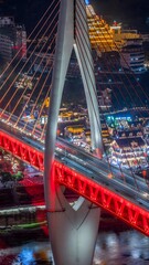 Obraz premium Aerial Night View of Illuminated Bridge and Urban Skyline in Chongqing China with Vibrant City Lights