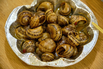 Cooked Escargots Served in Garlic Butter Sauce