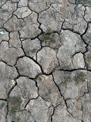 Completely grey dry ground after the lake dried, like a desert 