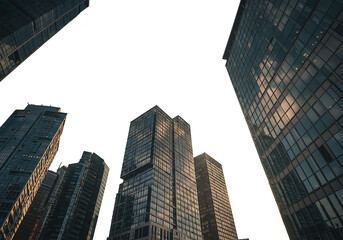 Obraz premium Majestic Cityscape: Skyscrapers Reaching for the Heavens at Sunset