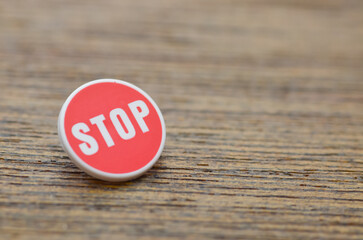 Single Stop Sign on Wooden Surface — Pause, Reflect, Reassess