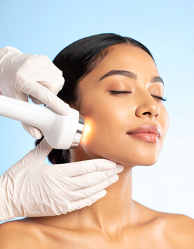 Beautiful woman in professional beauty salon during photo rejuvenation procedure
