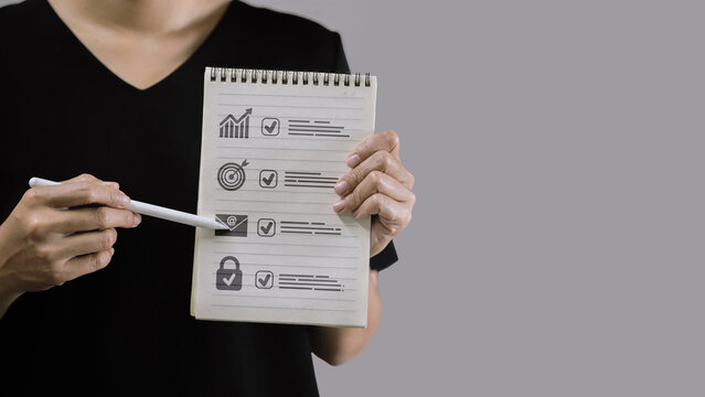 Business Planning Checklist on Notebook with Icons