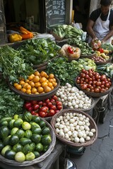 Vegetables displayed on a market stand. Different fresh vegetables inside wicker baskets on a display. A worker arranges vegetables at the market.