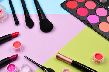 Professional makeup products with cosmetic beauty products, blushes, eye liner, eye lashes, brushes...