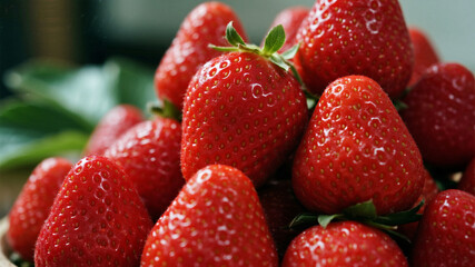 Fruit close-up: Close-up of fresh strawberries, stacked with delicate flesh and green leaves clearly visible