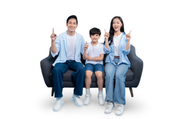 Family Portrait, happy family sitting on a modern sofa and pointing up PNG 