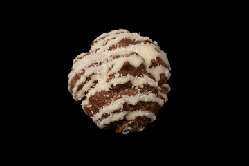 Profiteroles with coconut cream on a black background.