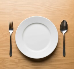 Top View of Empty White Plate on a Wooden Table