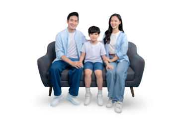 A happy family is sitting together on a modern couch in PNG 