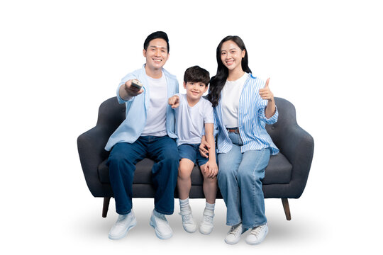 Happy family spending time together on a comfy couch, enjoying time together. Father is holding TV remote, mother is doing thumb up, son in the middle and happy with them on PNG 