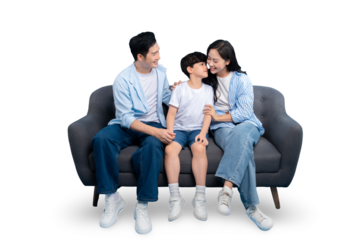 A loving family sitting closely together on a modern gray sofa, creating a warm and intimate portrait of family love and togetherness on PNG 