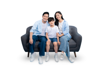 A happy family posing together on a sofa. A father, mother, and child are all smiling at the camera on PNG 