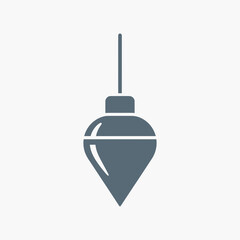 A plumb bob hangs against a white background.