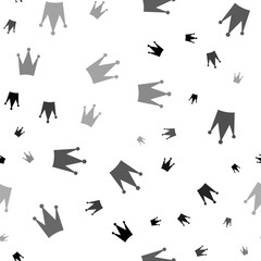 Seamless vector pattern with crown symbols, creating a creative monochrome background with rotated elements. Illustration on transparent background