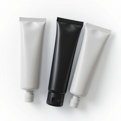 Three modern cosmetic tubes in black and white shades arranged diagonally on white background, designed for skincare or lotion product branding