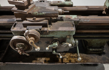 Vintage Metal Lathe Machine with Hand Cranks and Threading Mechanism Close-up