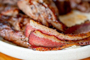 Sliced grilled beef steak-BARBECUE close-up. The detailed texture of the fried meat.