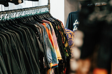Colorful clothes hanging in a thrift shop in Budapest