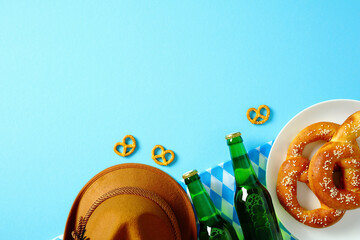 Oktoberfest celebration concept. Flat lay composition with salted pretzels, green beer bottles,...