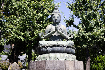 Ancient Quan Yin angel deity or Kuan Yin mercy goddess in antique shrine shinto of Sensoji temple for japanese people travelers travel visit respect praying blessing worship at Asakusa in Tokyo, Japan