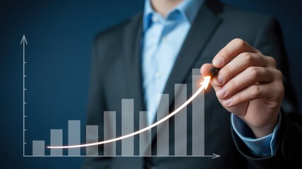 Businessman drawing an upward trending financial growth chart with a pen