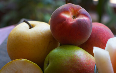 Various autumn fruits are placed under the window.