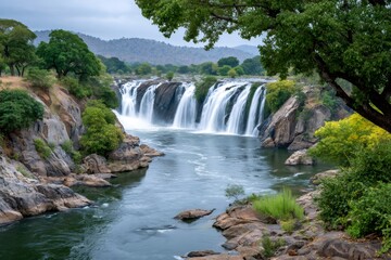 Obraz premium Hogenakkal falls cascading into the kaveri river, india, framed by lush green vegetation