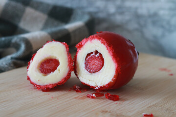 Delicious candied strawberry filled with creamy white chocolate, a tempting Brazilian treat known...