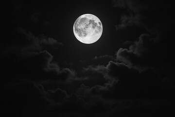 Luminous moon amidst dark clouds.