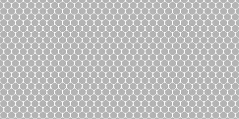 Dark carbon fiber seamless pattern texture of a metallic gray textile mesh grid background