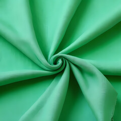 Folded Pastel Linen on Green Background 