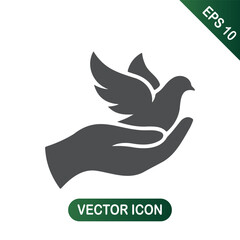 Hand holding dove of peace - Symbol of hope and harmony