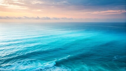 Naklejka premium Serene ocean horizon with gentle waves under a soft sky